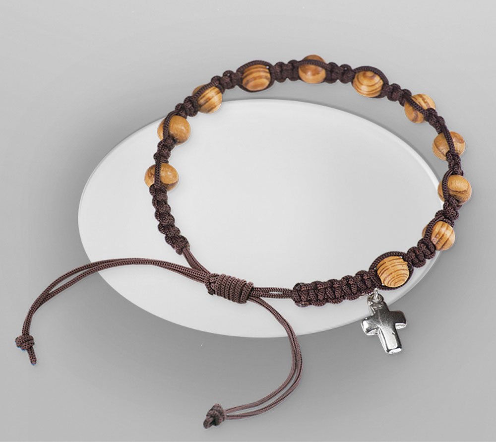 Bracelet with cross. Rope closure.