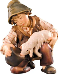 Pastor con cordero bebiendo