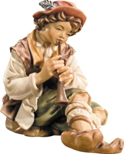 Pastor sentado con flauta