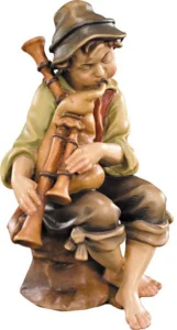 Pastor sentado con gaita