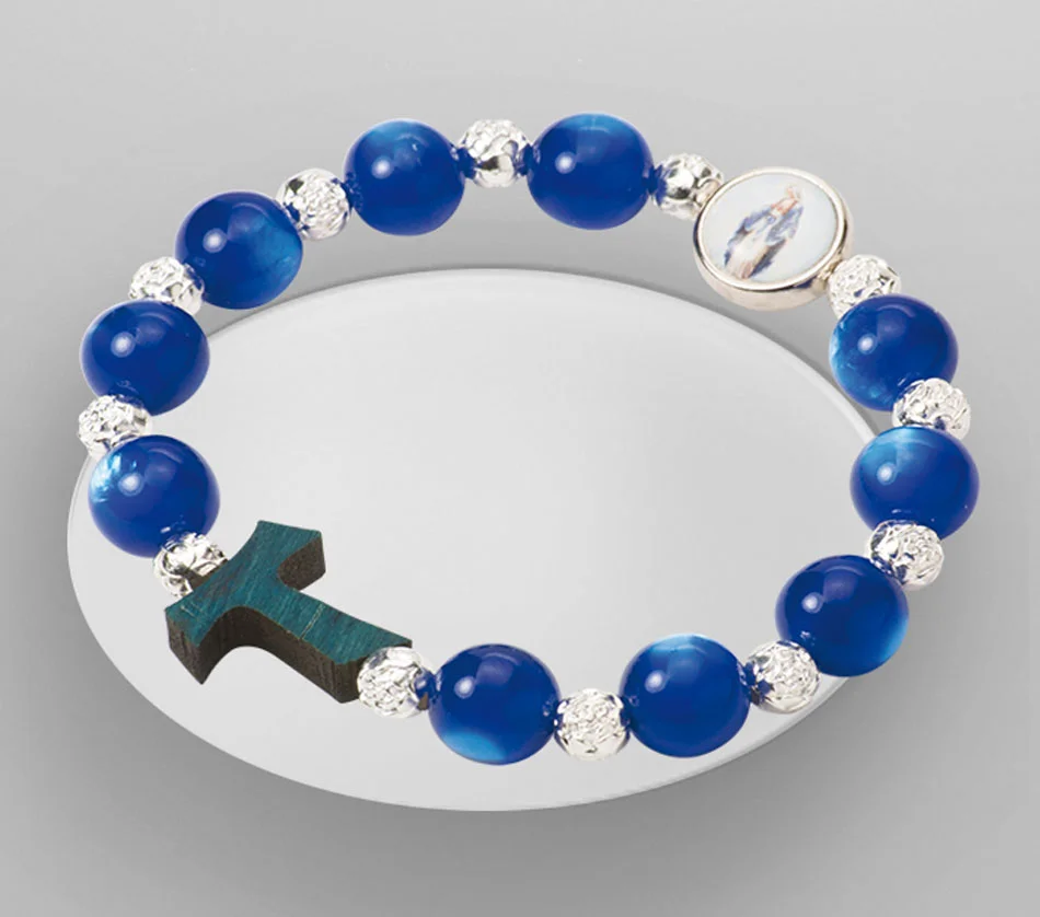 Pulsera con cruz y Virgen Milagrosa, cristal bohemia. Elástico.
